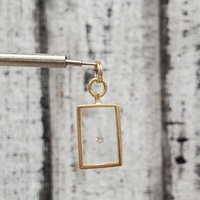 14K Diamond In Clear Rectangular Case