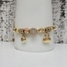 14K Charm Bracelet w/ CZ + Purse + Other Shaped Beads 